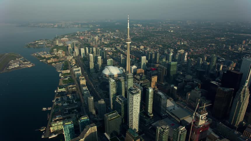 An aerial view of tall skyscrapers in a coastal city