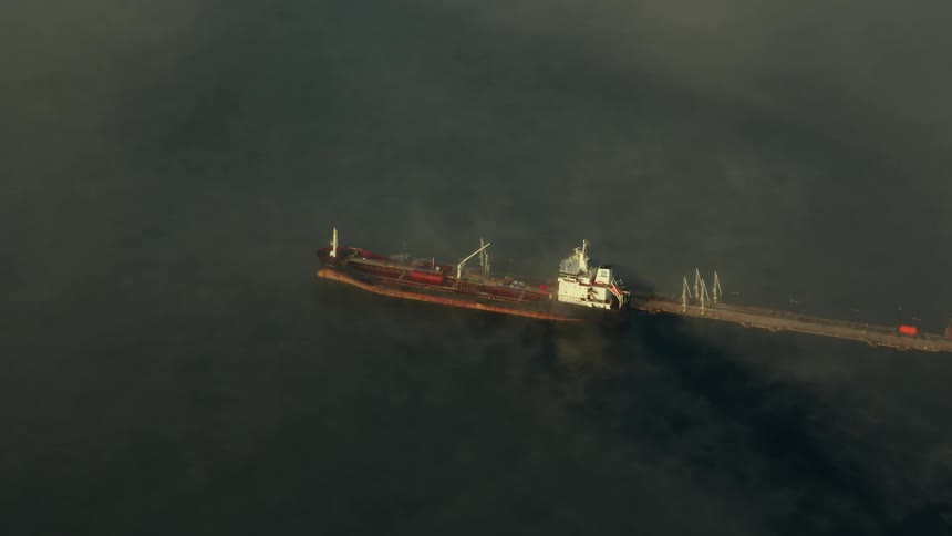 A boat is driving on the ocean water