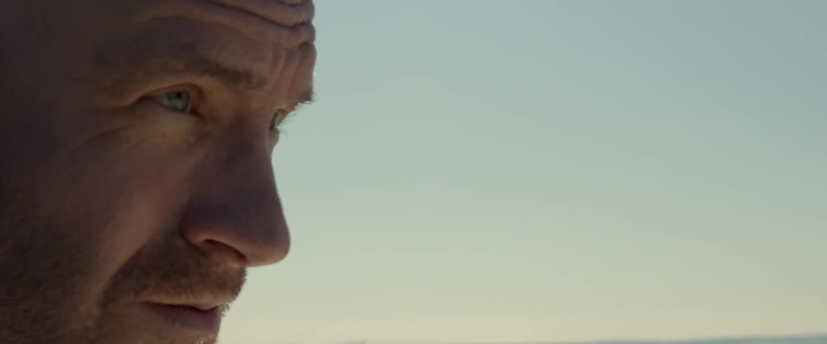 A man is looking outside