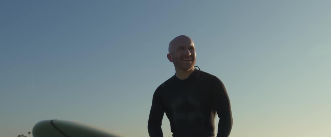 Men are on surfboards waiting for a wave