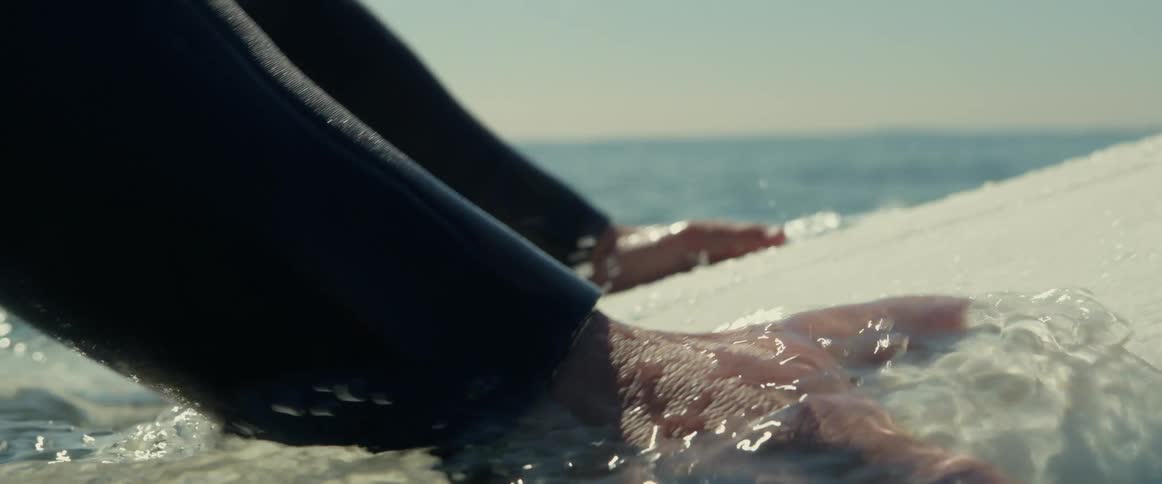 A person on a surfboard outdoors