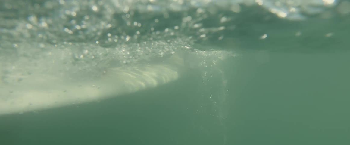 A person is paddling on their surfboard