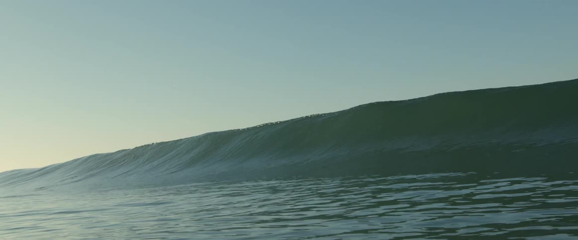 A wave rolls in and over itself