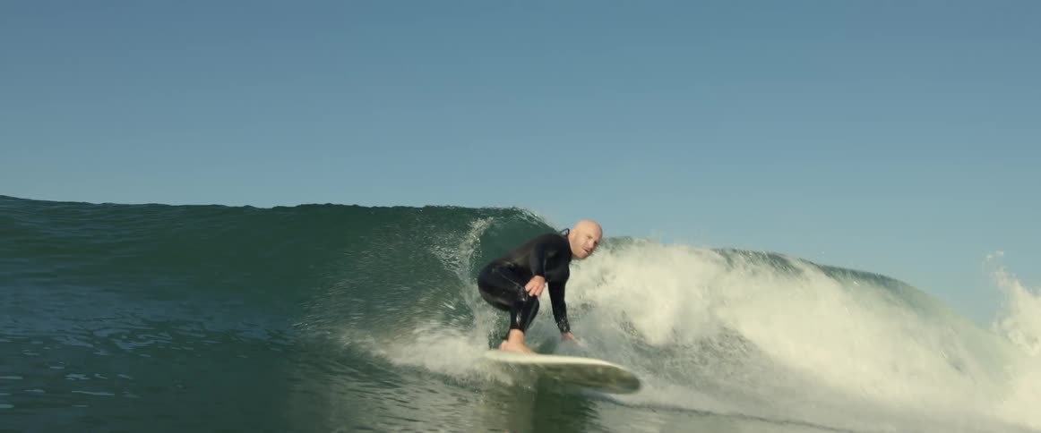 A man rides the wave in the ocean
