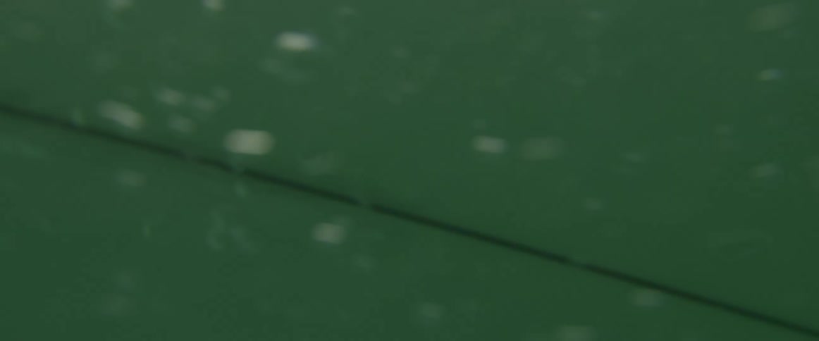 A person is surfing in the ocean water