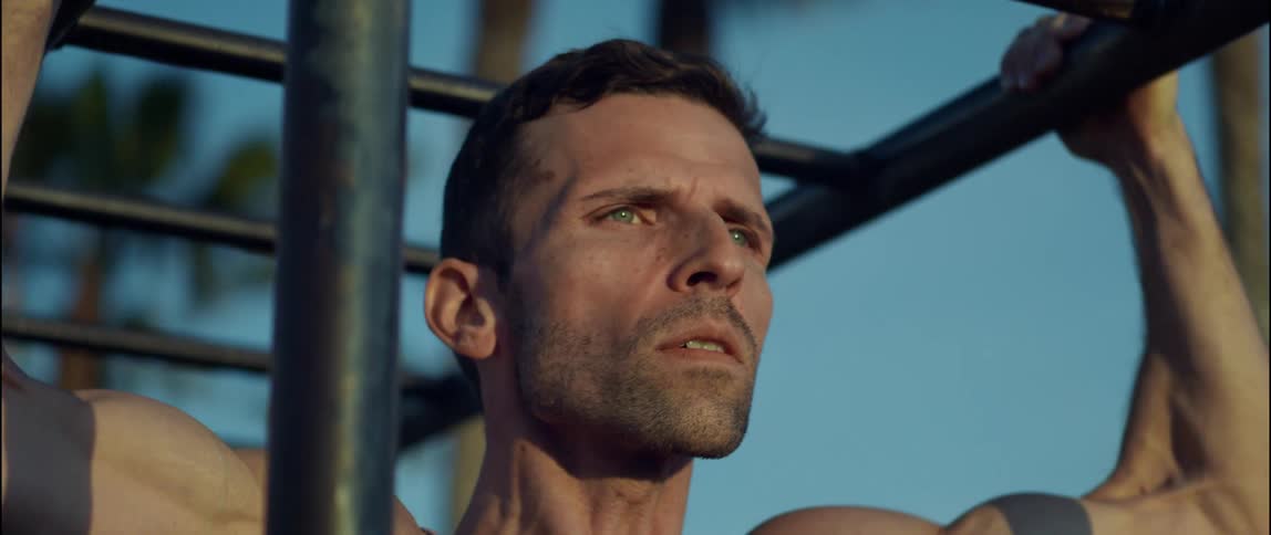 A man is exercising outdoors during the daytime
