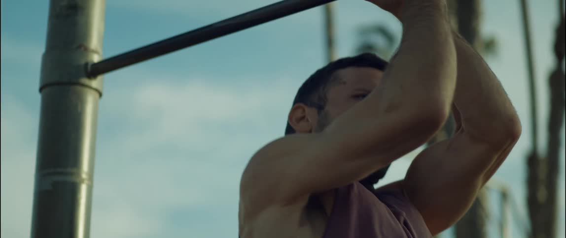 A man is doing pull ups
