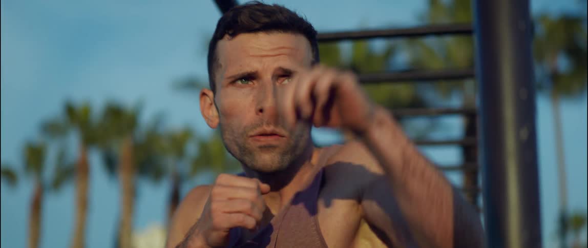 A man is punching outside