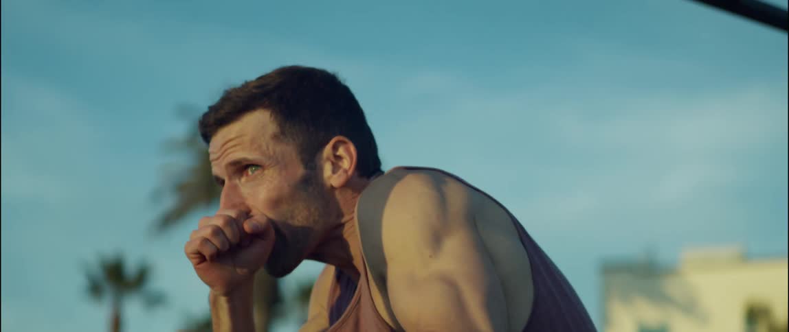 A man is shadowboxing outside
