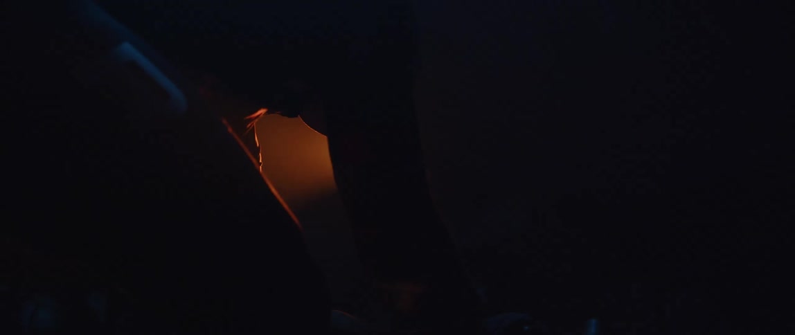 A man exercises with a glaring red light onhim