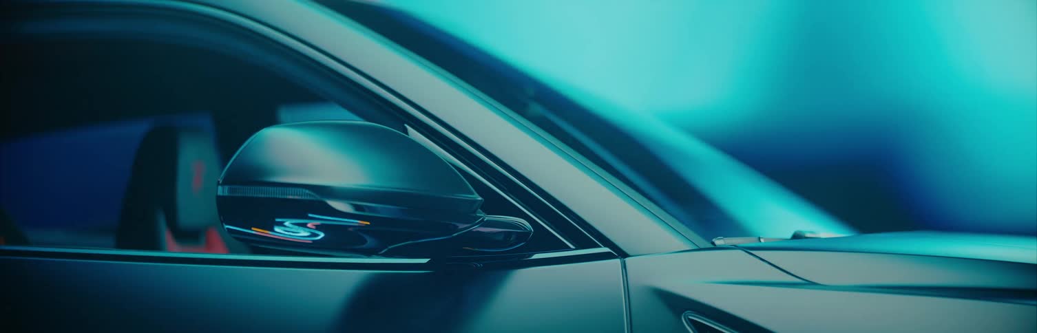 A multicolored background speeds by a driverless car