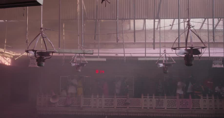 Ceiling fans spinning in a large room during the day