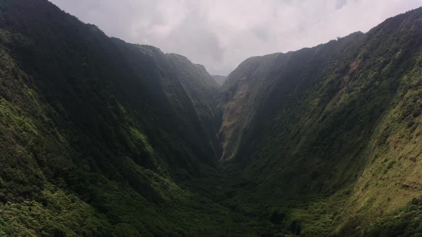 A river runs below a tall canyon