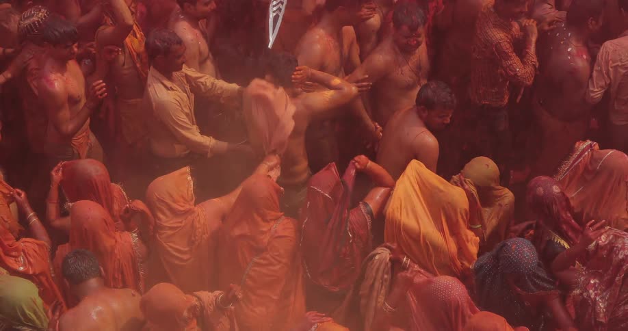 People are celebrating below and throwing dirt everywhere