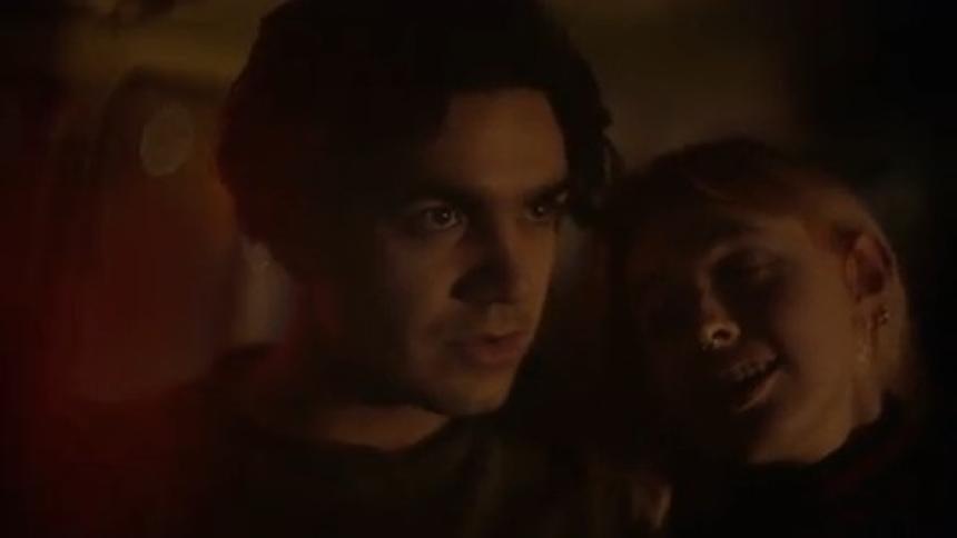 A woman leans her head against her boyfriends shoulder