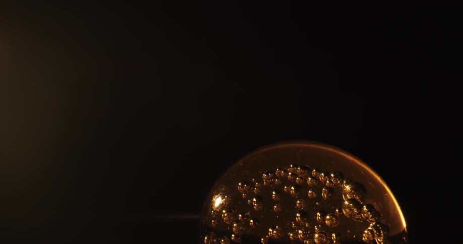 Abstract footage of a sphere filled with bubbles and light