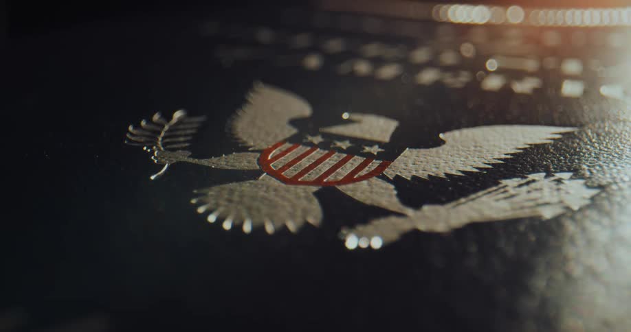 A plaque features an emblem of an american eagle with a stars and stripes shield
