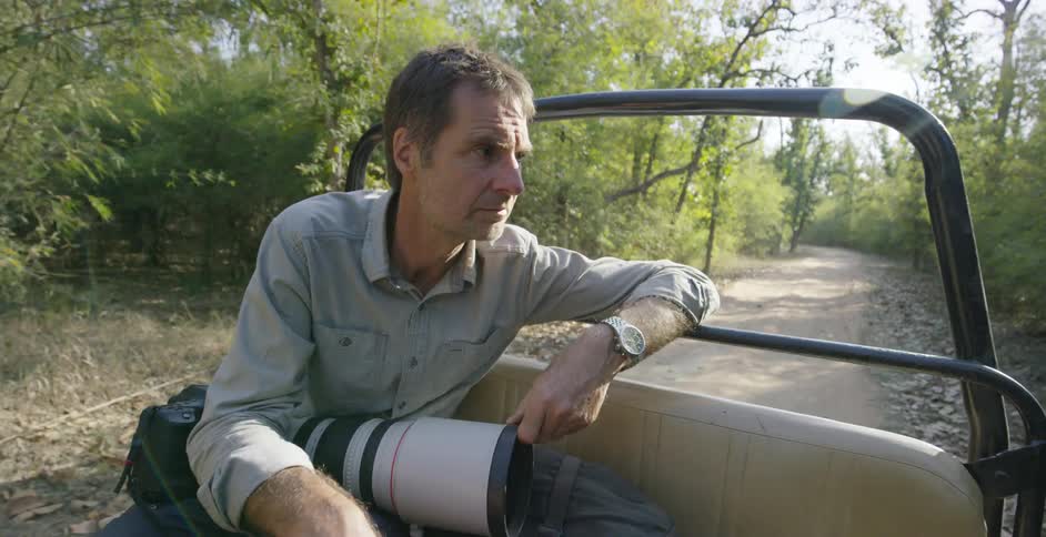A man rides in an open vehicle