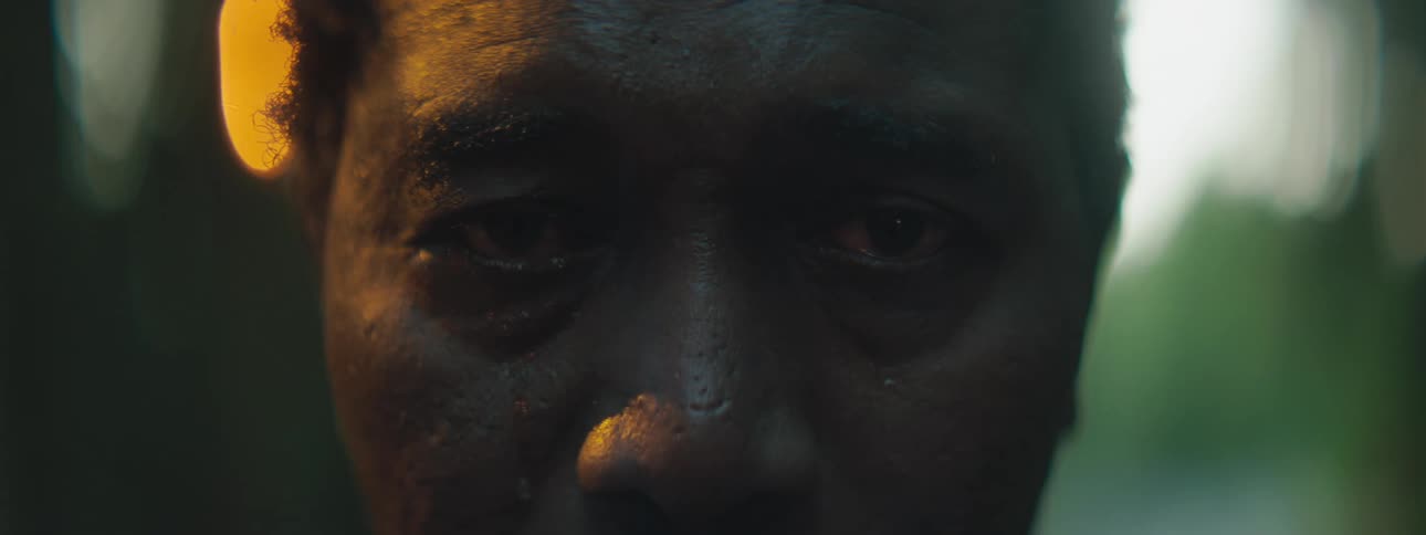 A man blinking and crying