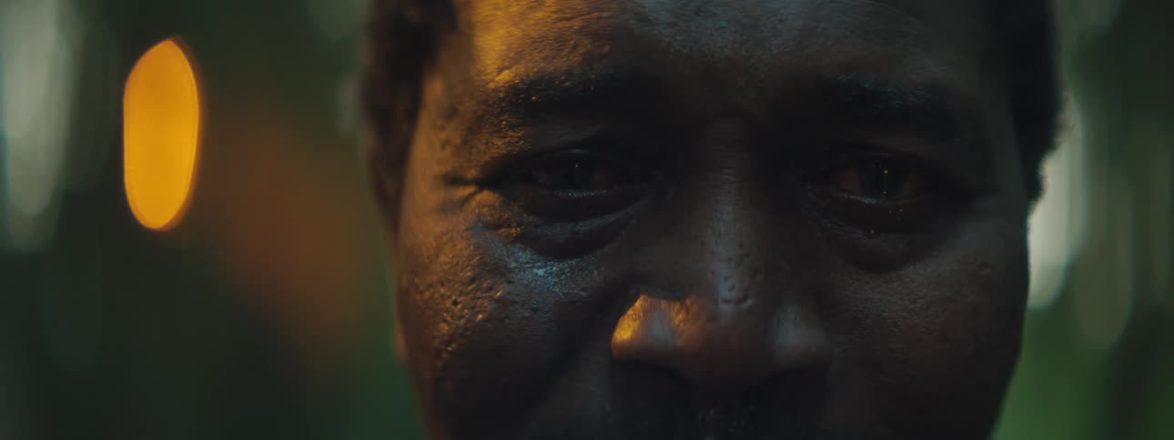 A black man crying outside