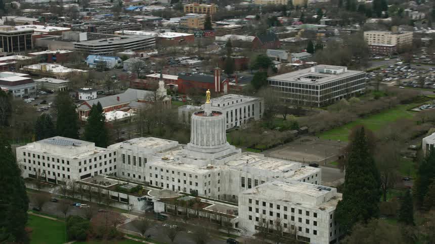 A large white building is in the city