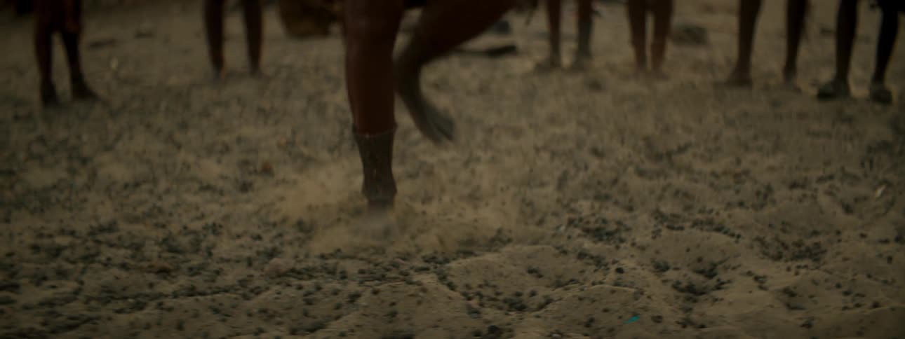 Human stomping on ground in a crowd of others