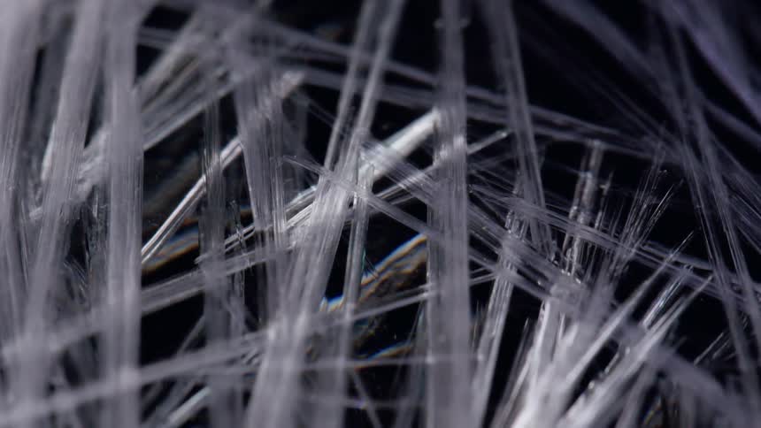 Fibers that appear like ice make up a pattern in the night