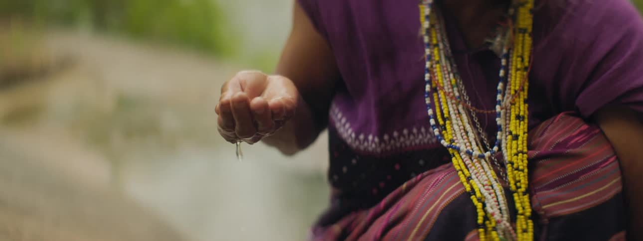 A person drops water from her hand