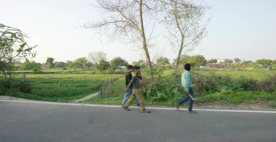 Men walking along a rural road