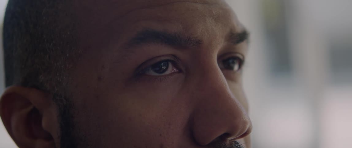 A man looks around a room as he thinks