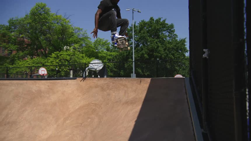 A skateboarder jumps