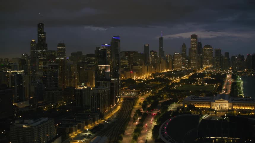 Wide roads through a metropolis on a cloudy night