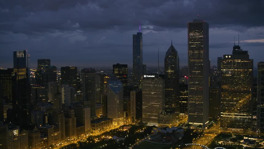 Tall buildings and skyscrapers in a metropolis on a cloudy evening