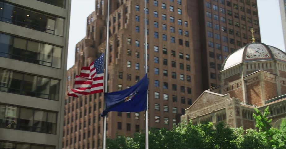 Flags hold at half mast in downtown near church