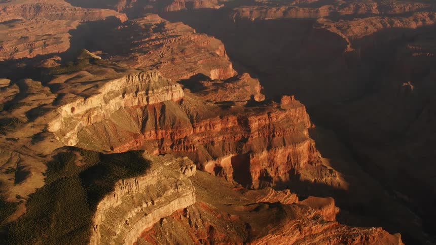 Canyons of varying heights cast shadows upon each other