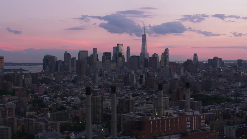 A city is seen as the sun is setting