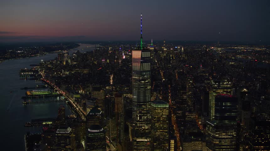 An aerial view of buildings outdoors at night