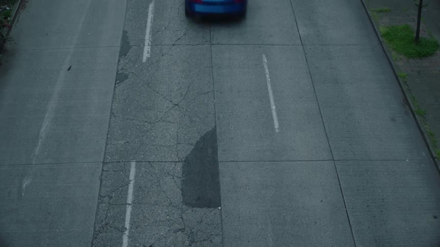 A car passes by on the street