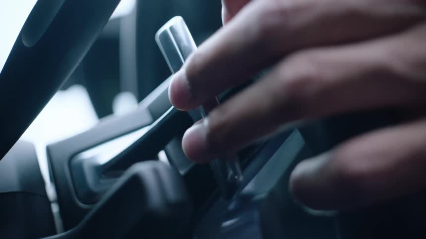 Close up view of a person driving a vehicle