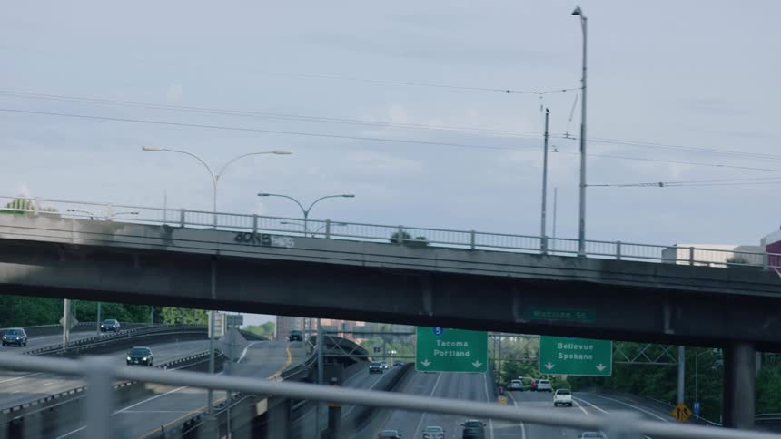 Cars travel on a washington state highway with on and off ramps