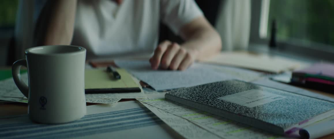 A man sits at his table