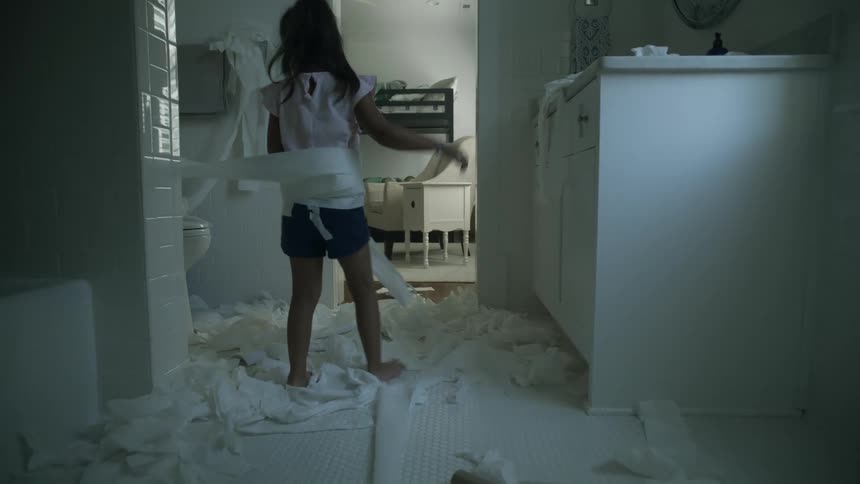 A girl playing with paper