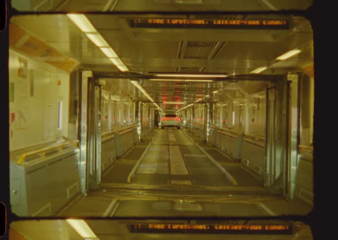 A vehicle driving through a ferry