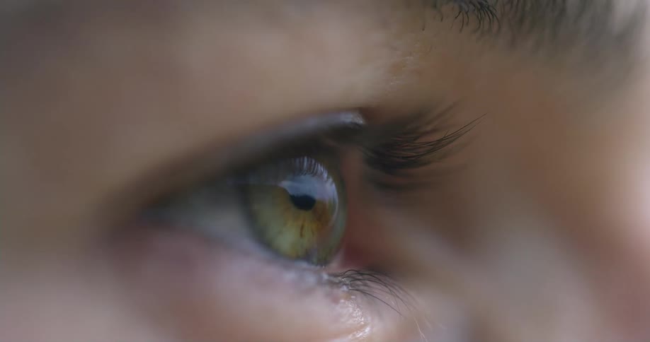 A person blinks her eye