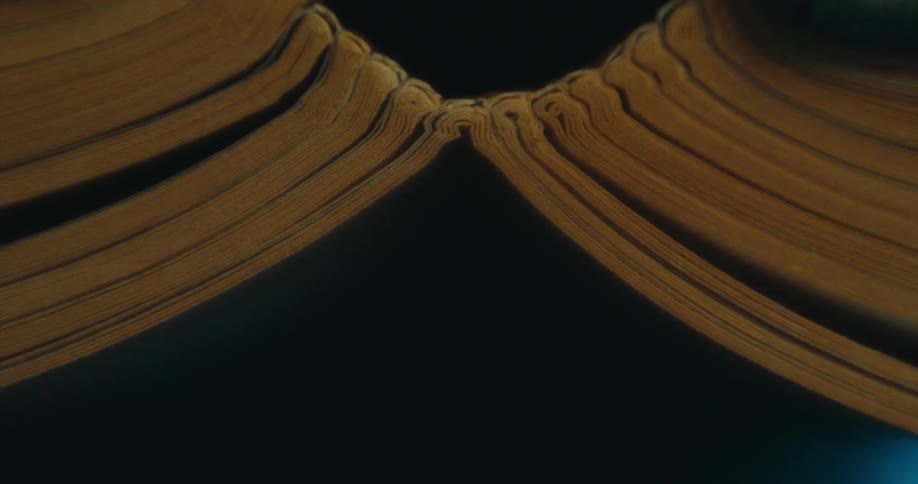 Blue lights flow across dark surface under interconnected gold bands