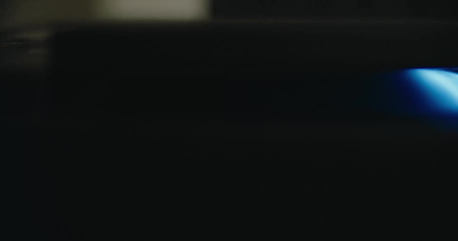A blue light moves on a copy machine