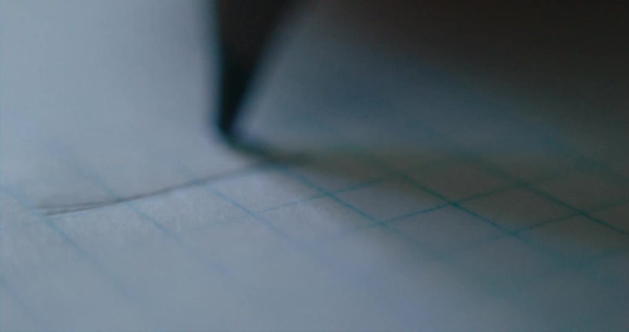 Close up of a pencil writing on paper