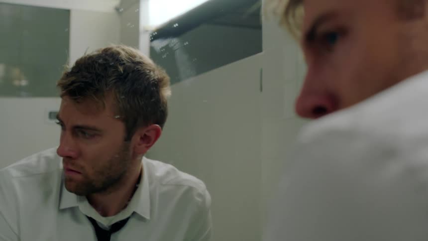 A man standing in a bathroom