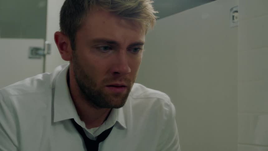 A man is crying in the bathroom