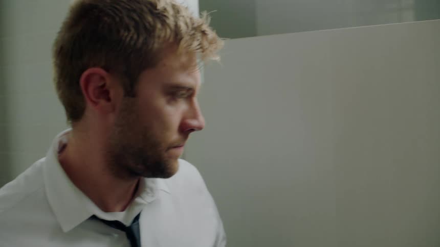 A man enters the bathroom
